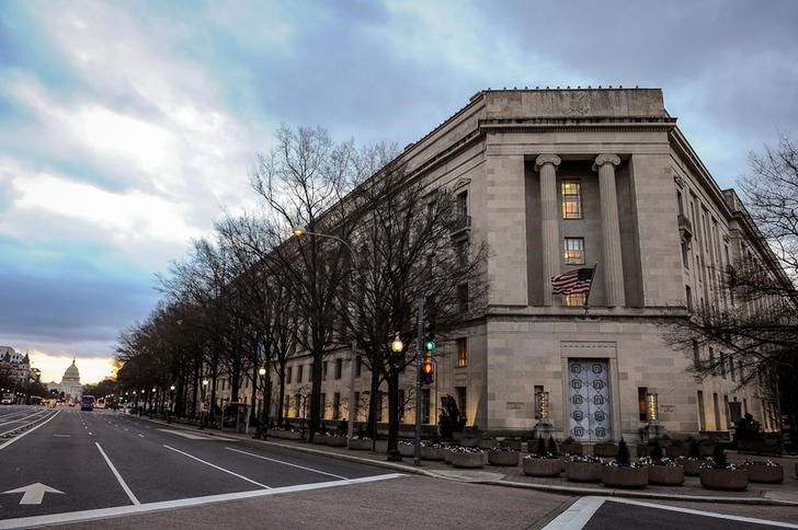 U.S. Department of Justice building is bathed in morning light at sunrise in Washington, U.S., February 14, 2020. REUTERS/Mary F. Calvert