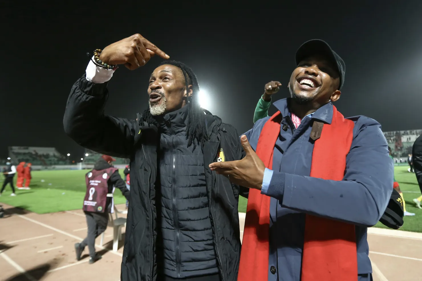 Samuel Eto’o, right, and Cameroon coach Rigobert Song celebrate after the controverisial win in the World Cup qualifying match against Algeria.CREDIT:AP