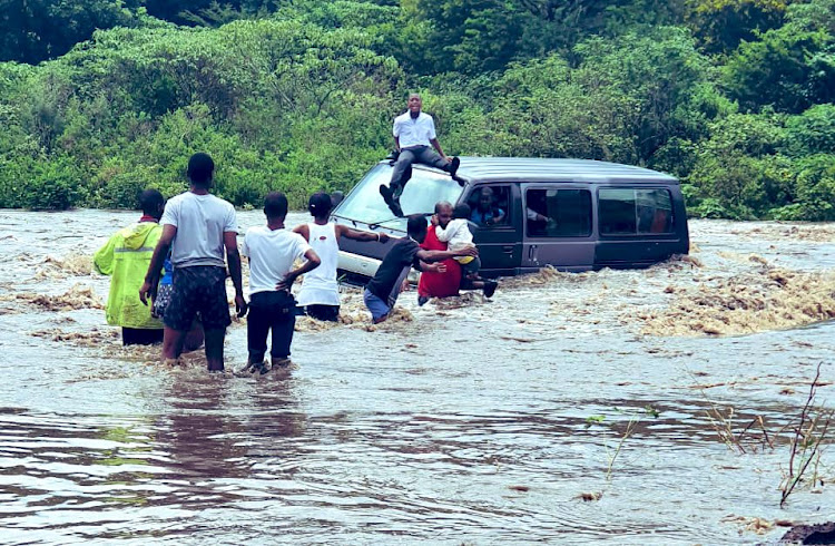 A KwaZulu-Natal man jumped into a flooded river to save 17 primary school pupils from being swept away after a taxi driver tried to cross a flooded low-lying bridge.