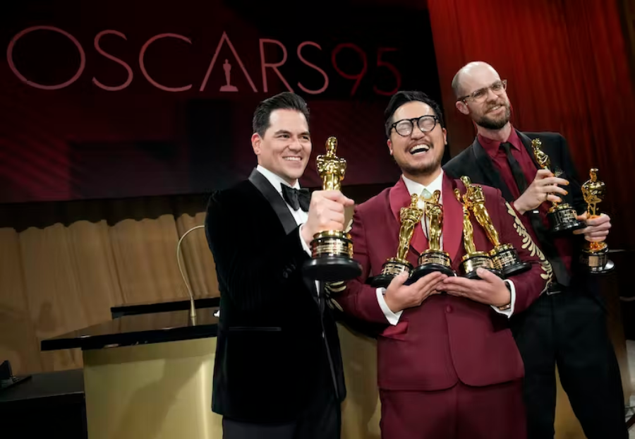 Jonathan Wang, from left, Daniel Kwan and Daniel Scheinert pose with their awards for best picture for ‘Everything Everywhere All at Once’ after the Oscars on March 12, 2023, in Los Angeles. Kwan and Scheinert also won the awards for best original screenplay and best director for the film. (AP Photo/John Locher)