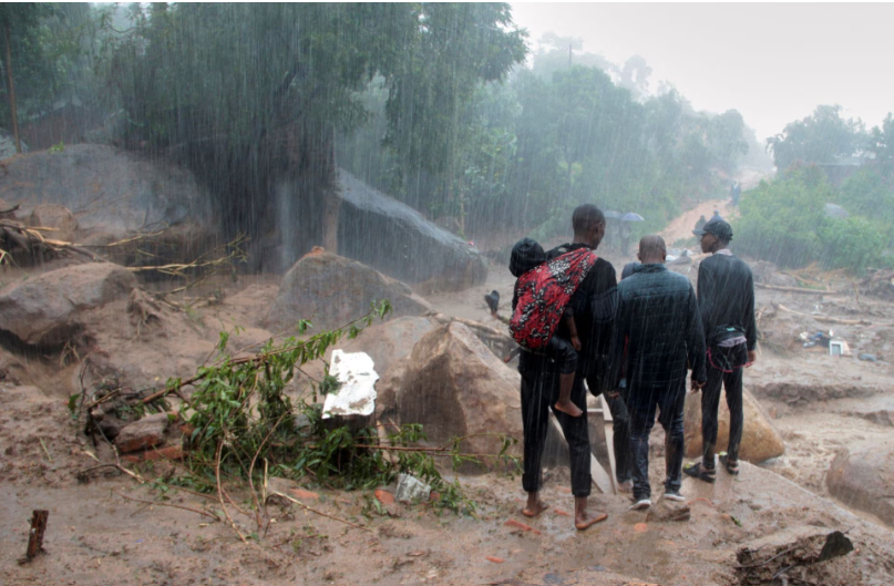 ] People look at the damage caused by Cyclone Freddy in Chilobwe, Blantyre, Malawi, March 13, 2023. REUTERS/Eldson Chagara.