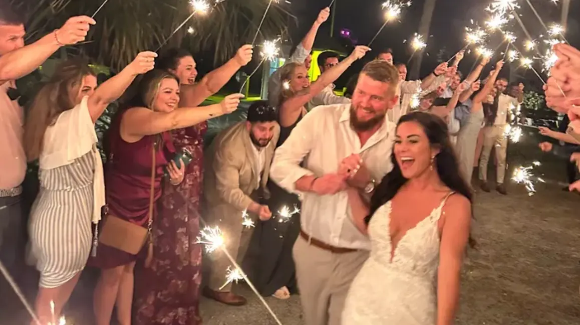 Aric and Sam smiling as they left their wedding celebration Friday night in South Carolina, just before a drunk driver struck the golf cart they were in.GoFundMe