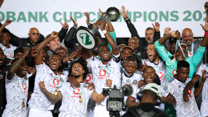 Orlando Pirates players celebrate with the trophy after beating Sekhukhune United in the final of the Nedbank Cup at Loftus Versfeld in Tshwane on Saturday. Photo: Samuel Shivambu/BackpagePix