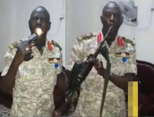 A yet-to-be-identified African soldier took to social media to show off the potency of his bulletproof charm as he fires different types of guns into his mouth without any fatal injury.