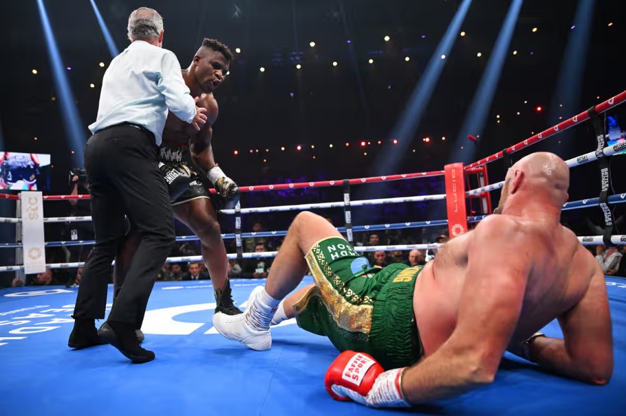 Tyson Fury is knocked down by a huge left from Francis Ngannou before recovering to avoid humiliation in Saudi Arabia. Photograph: Justin Setterfield/Getty Images