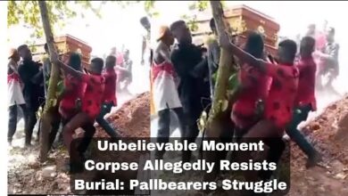Pallbearers struggle with coffin