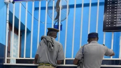 Two police officers were photographed placing bets in Harare