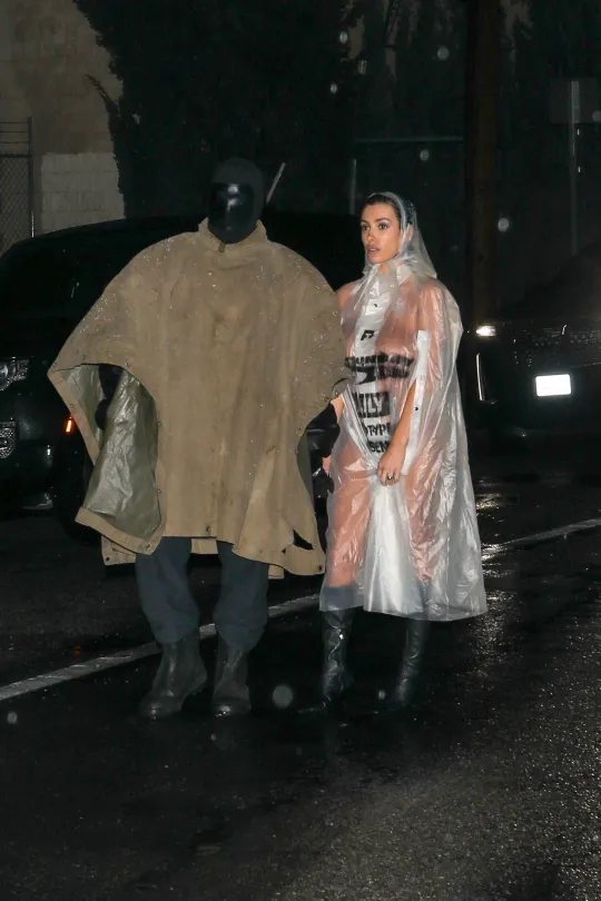 The couple were at least sensible in protecting themselves from the storm (Picture: The Daily Stardust/ Khrome / Backgrid)