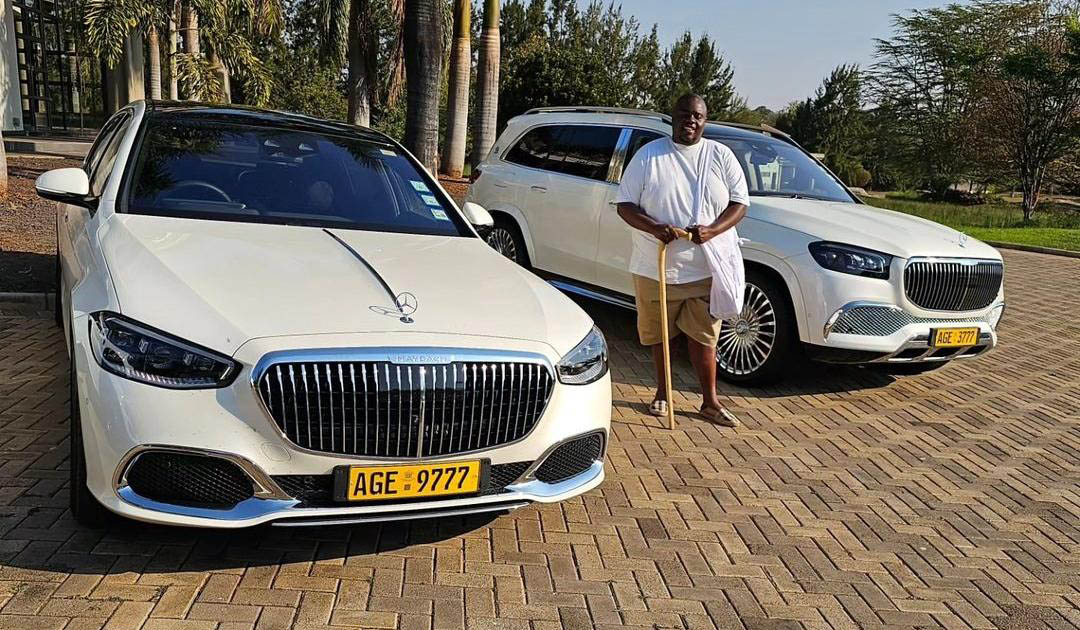 Wicknell Chivhayo posing with some of the vehicles bought in nine-month splurge